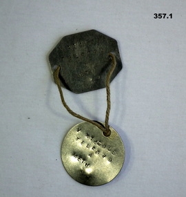 Identification disc’s and uniform badges WW2