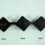 Blackened uniform rank shoulder badges