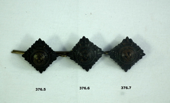 Blackened uniform rank shoulder badges