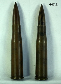 Two brass cartridges possibly .50 caliber.