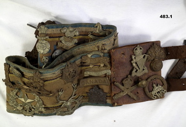 Belt with some 47 badges collected WW1