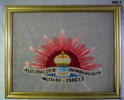 Framed embroidered Rising Sun badge