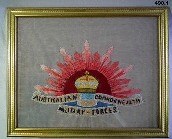 Framed embroidered Rising Sun badge