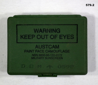 Green tin containing 3 x camouflage skin colours