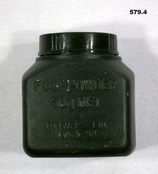 Green plastic container of foot powder.