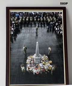 Framed photograph of a Cenotaph assembly.