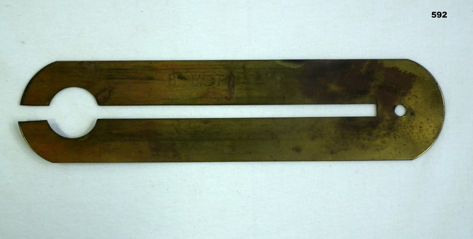 Item for holding brass buttons on uniform re cleaning.