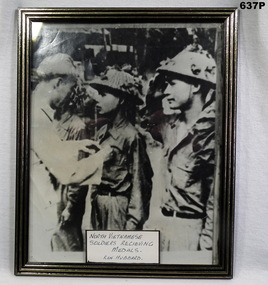 B & W photo showing medal presentation North Vietnam.