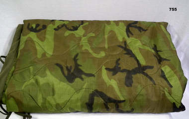 Camouflaged Poncho liner souvenired in Vietnam