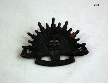 Blackened Rising Sun hat badge.