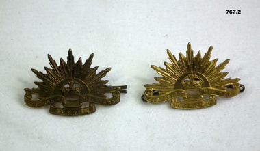Two brass Rising Sun Lapel Badges