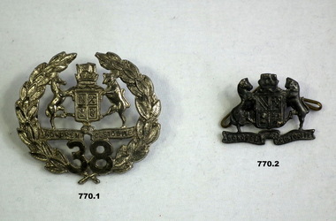 Two 38th Bn badges post WW1