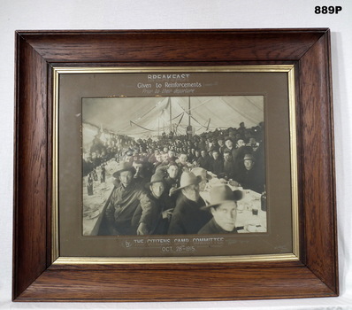 B & W photo showing troops having breakfast