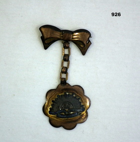 Trench art brooch with Rising Sun