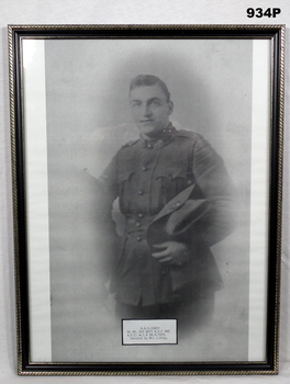 B & W photo of a soldier holding slouch hat