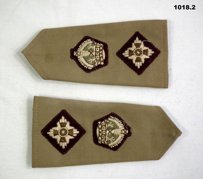Two officers rank shoulder epaulettes.