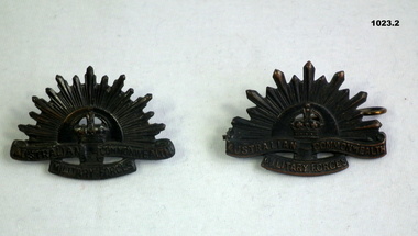 Two Rising Sun uniform lapel badges