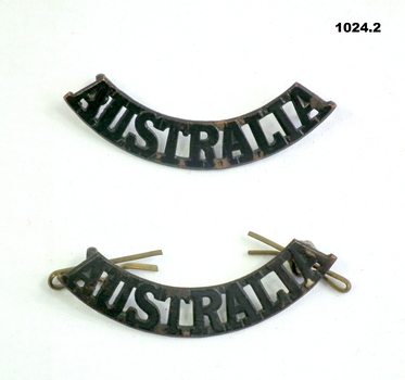 Two “Australia” shoulder epaulette badges