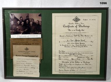 Photo, certificate, books all in a frame