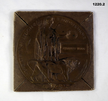 Bronze memorial plaque with package cover