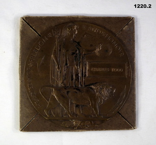 Bronze memorial plaque with package cover