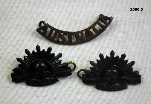 two uniform lapel and one Australia badges.