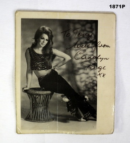 Photo of a women seated with text on.