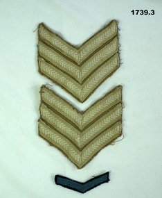 Two Sergeants rank badges and one service chevron.