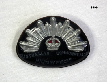 Badge, trench art representing a rising Sun badge