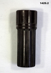 Brown small cylinder with built in compass