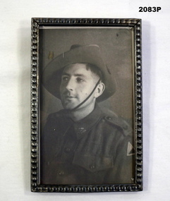 Framed B & W photo of an AIF soldier WW2