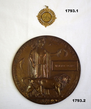 Memorial plaque and small medallion