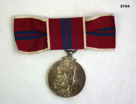 The Queens Coronation medal and ribbon.