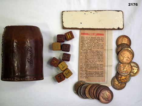 Leather container with a penny two up set.