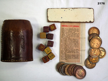 Leather container with a penny two up set.