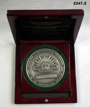 Initiative and teamwork medallion to a soldier.