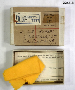 Postage box and cards that medals sent in.