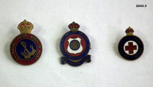 Three different association badges.
