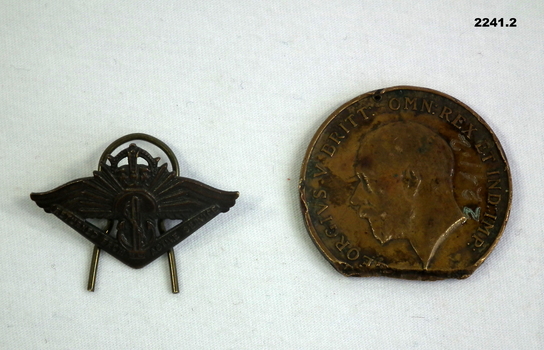 Badges relating to active service and Merchant Navy.