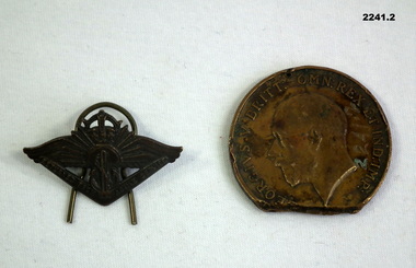 Badges relating to active service and Merchant Navy.