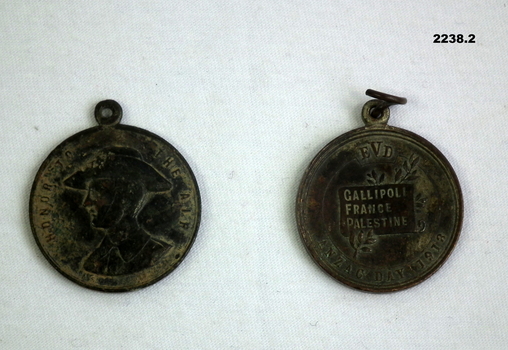 Two commemorative medallions re WW1