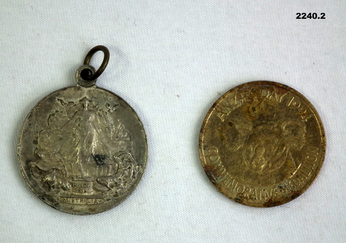 Two medallions relating to 1919 and 1994