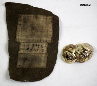 Fabric with name and RAMC buttons.
