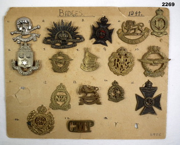 Sixteen badges from differant countries mounted on card.