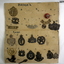 A collection of badges from different countries mounted.