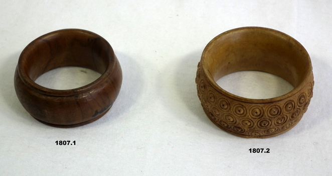 Two carved wooden napkin rings WW1