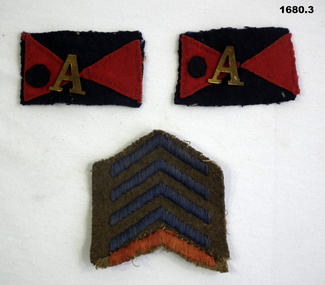 Two colour patches with “A” and chevrons.