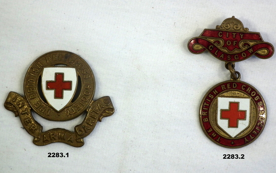 Two Red Cross badges part of wider collection.
