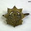 Five badges part of a wider collection.