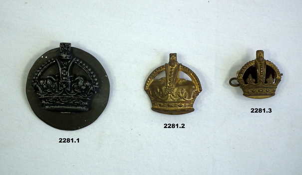 Three badges part of a wider collection.